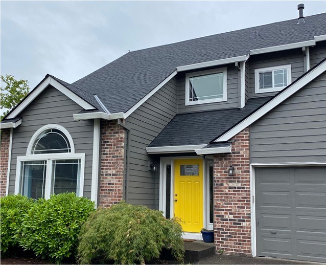 Multi-family home in Oregon with black composition roofing
