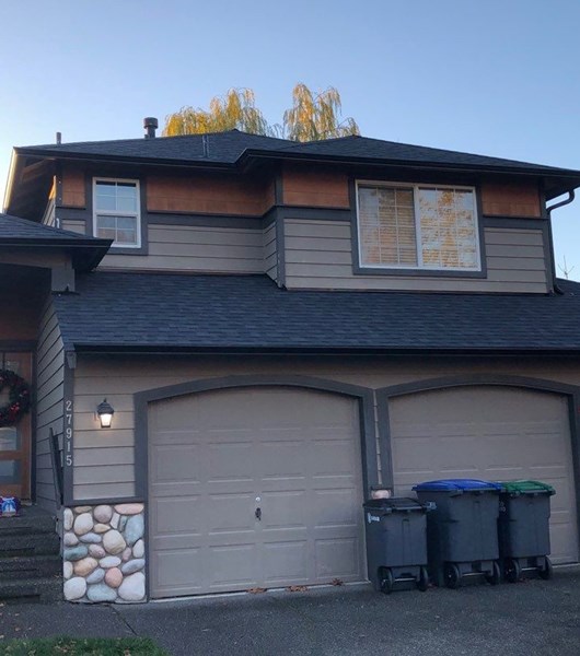 Black aluminum gutter replacement on two story home in Portland. OR
